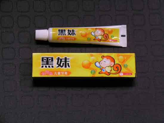 Front of Pack of Hei Mei Toothpaste (42gm) Yellow Pack with Monkey