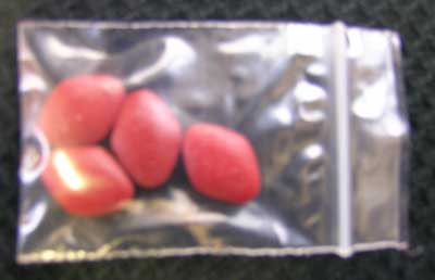 Red/Brown tablets marked 800mg. 